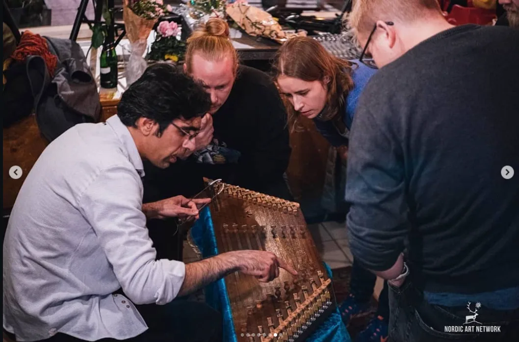 Farshad Sanati demonstrating santur in a workshop.